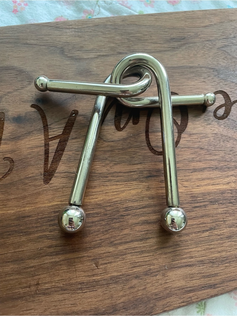 Silver metal puzzle with a unique design